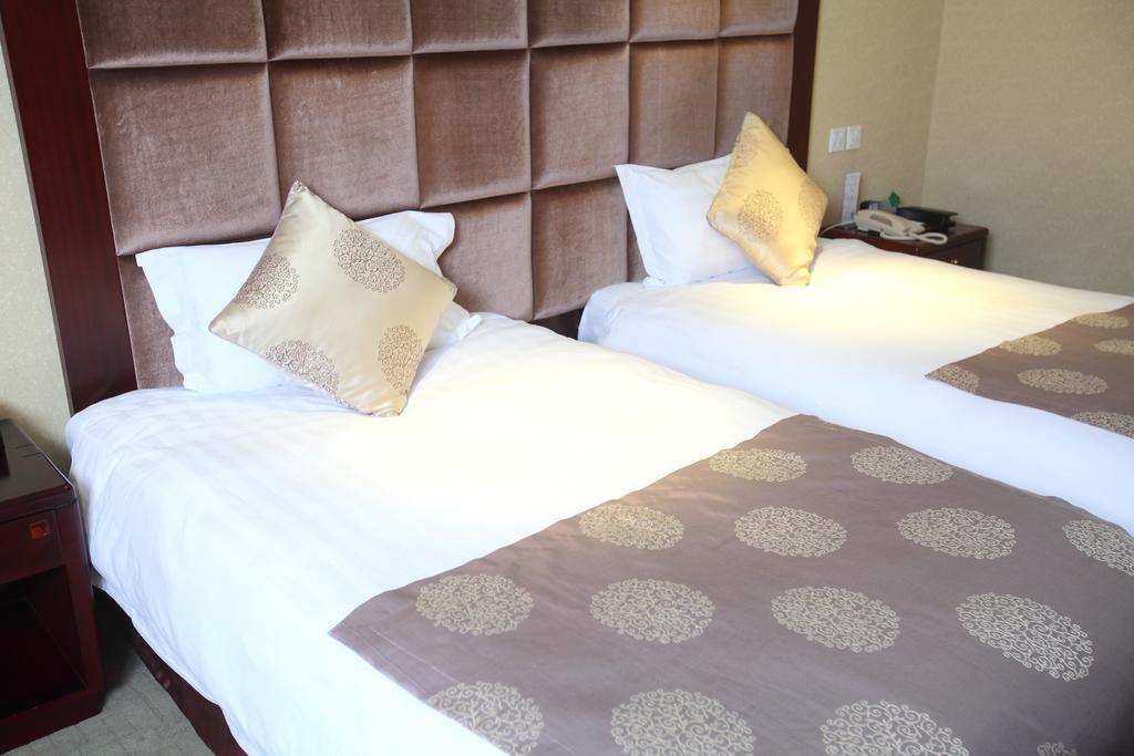 Qingdao Sanfod Hotel Pokoj fotografie